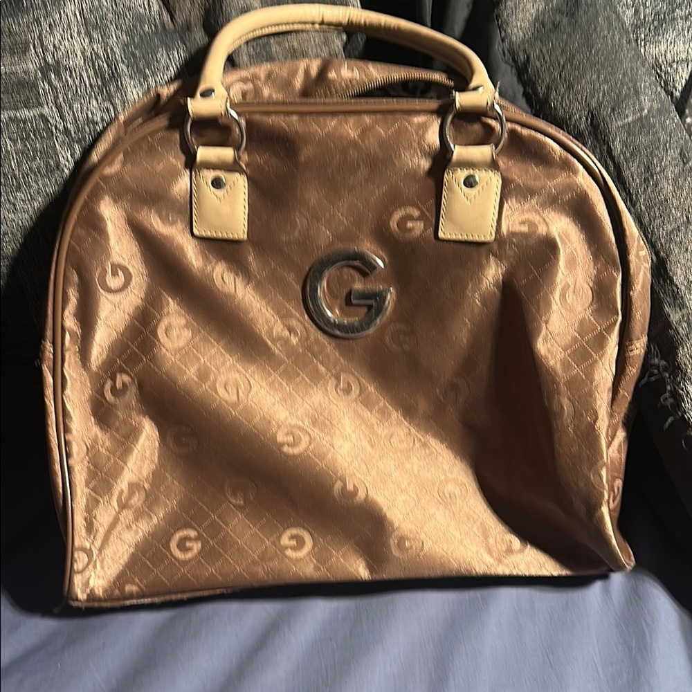 Brown and Tan Travel Bag with Embossed Pattern